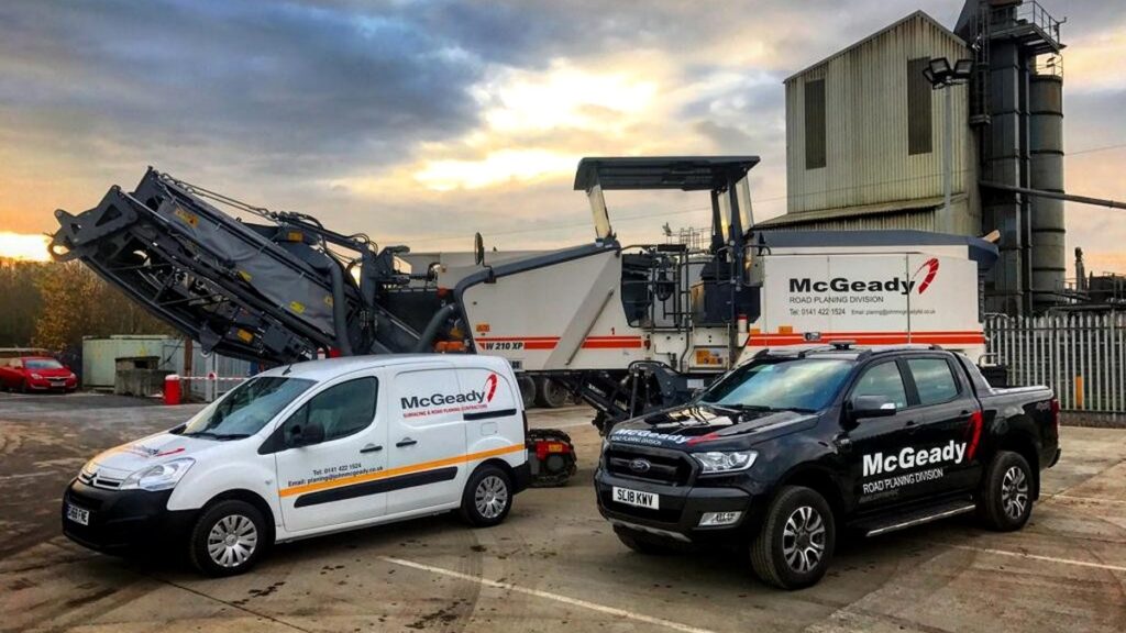 John McGeady Ltd road planing vehicles and plant at an industrial site.