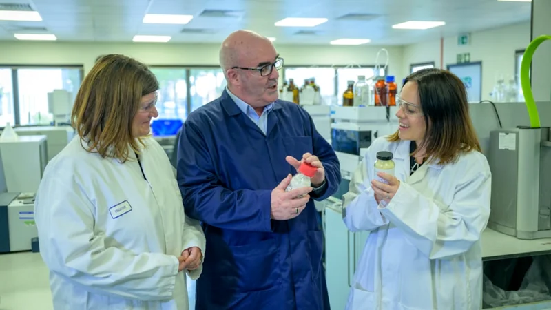 Three people examining laboratory samples at Syngenta's Grangemouth facility
